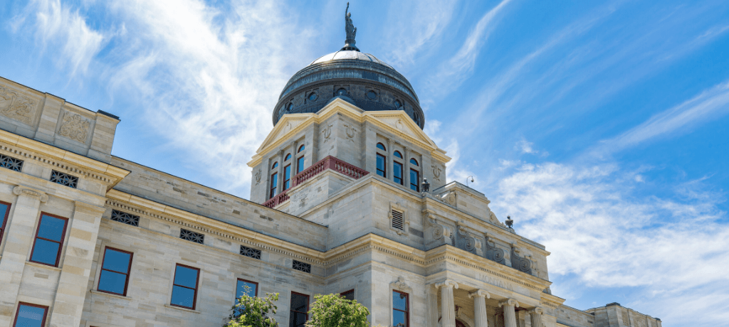 Montana State Capitol Building in Helena, Montana, under a blue sky.