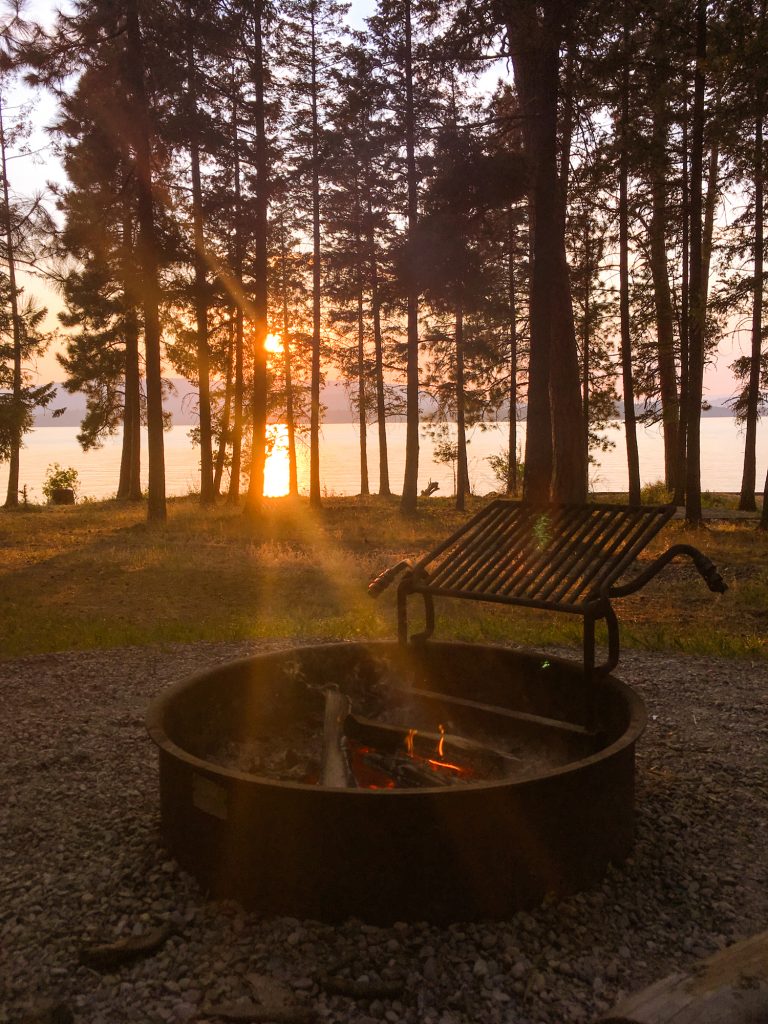 Sunset and lake view by the campfire at Finley Point Campground